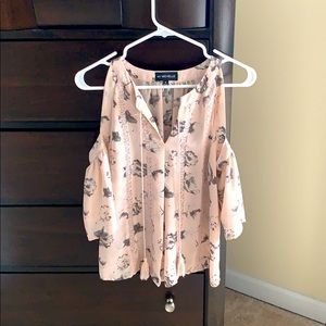 Soft pink blouse with cold shoulders.